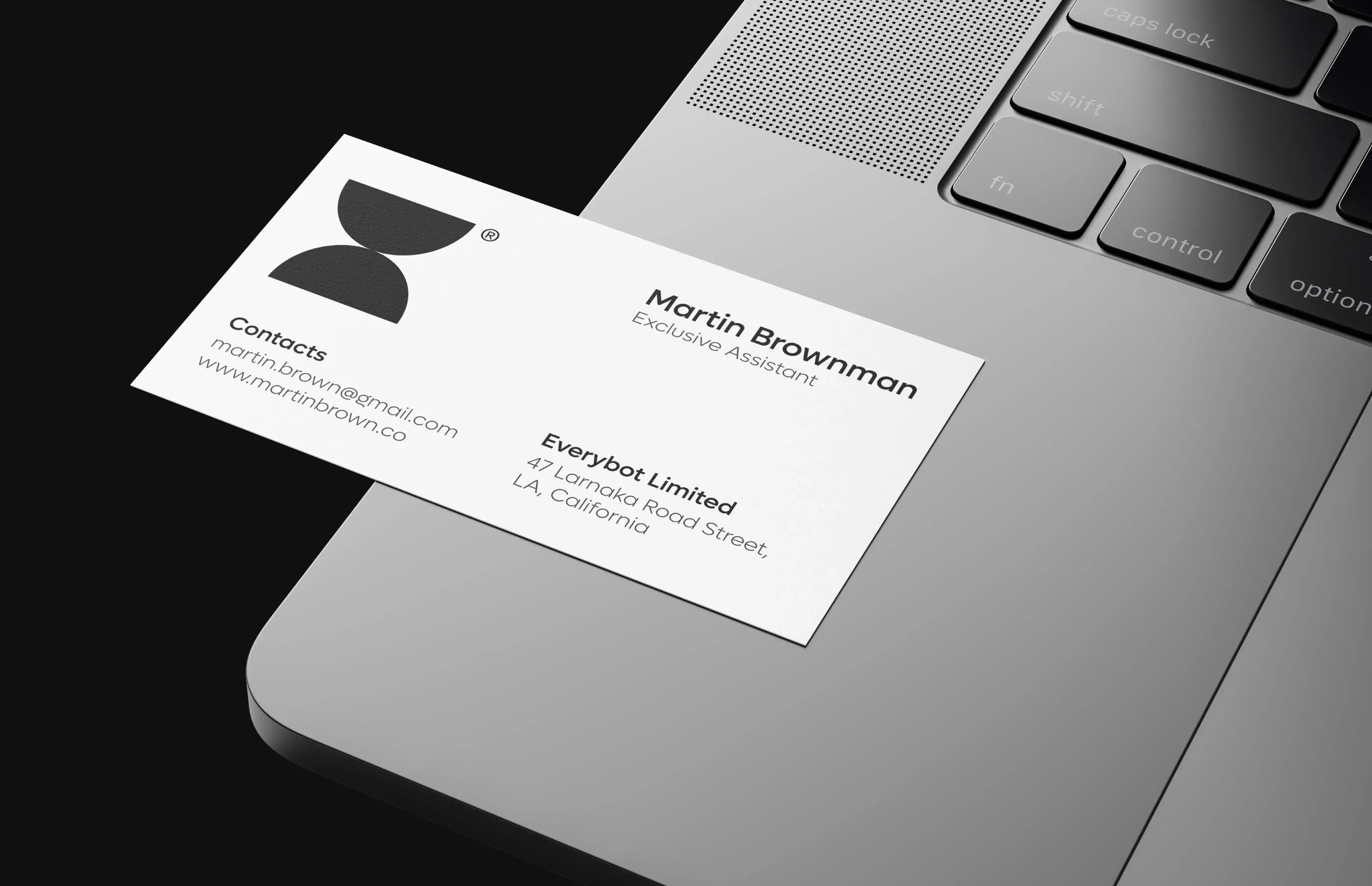 Printed business card or document with silver text, representing a startup mobile app business. Printed business card or document with silver text, representing a startup mobile app business.