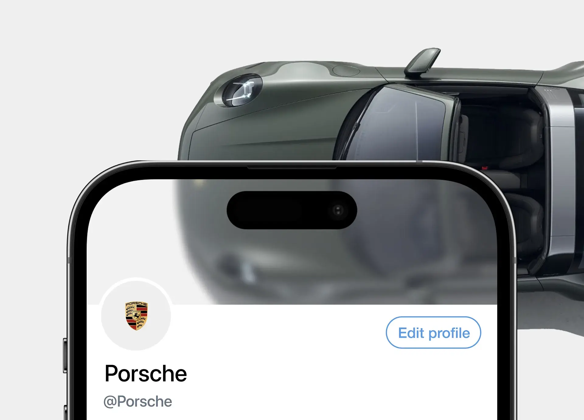 Screenshot of a Porsche mobile interface or profile on an iPhone, shown near a car door and mirror. Screenshot of a Porsche mobile interface or profile on an iPhone, shown near a car door and mirror.