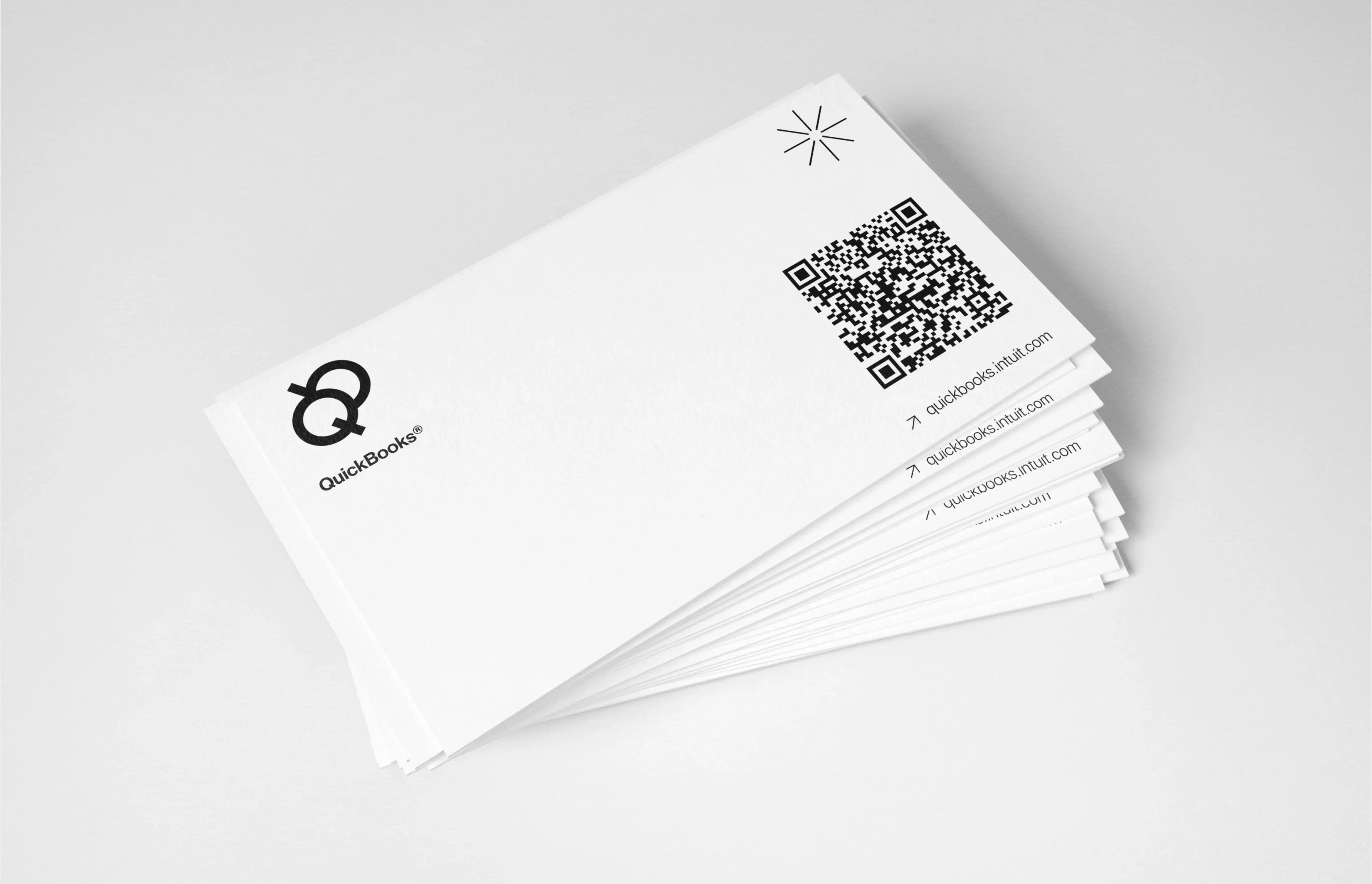 A paper document featuring QuickBooks branding and a QR code, illustrating finance service examples.