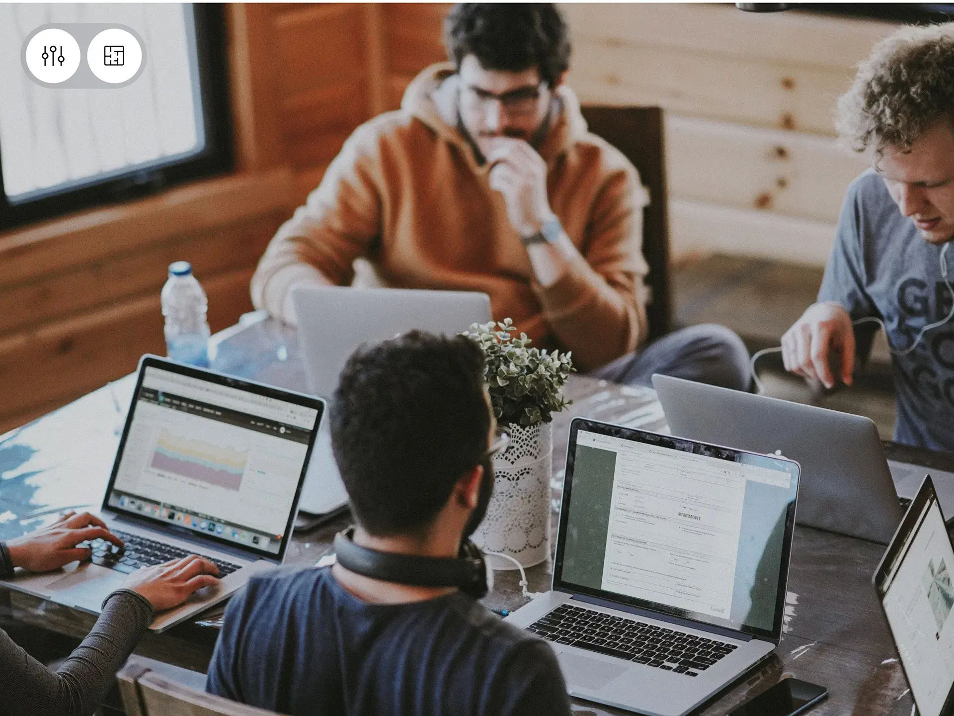 People using laptops with "Card GA" text on screen, relevant to finance app UX/UI design. People using laptops with "Card GA" text on screen, relevant to finance app UX/UI design.