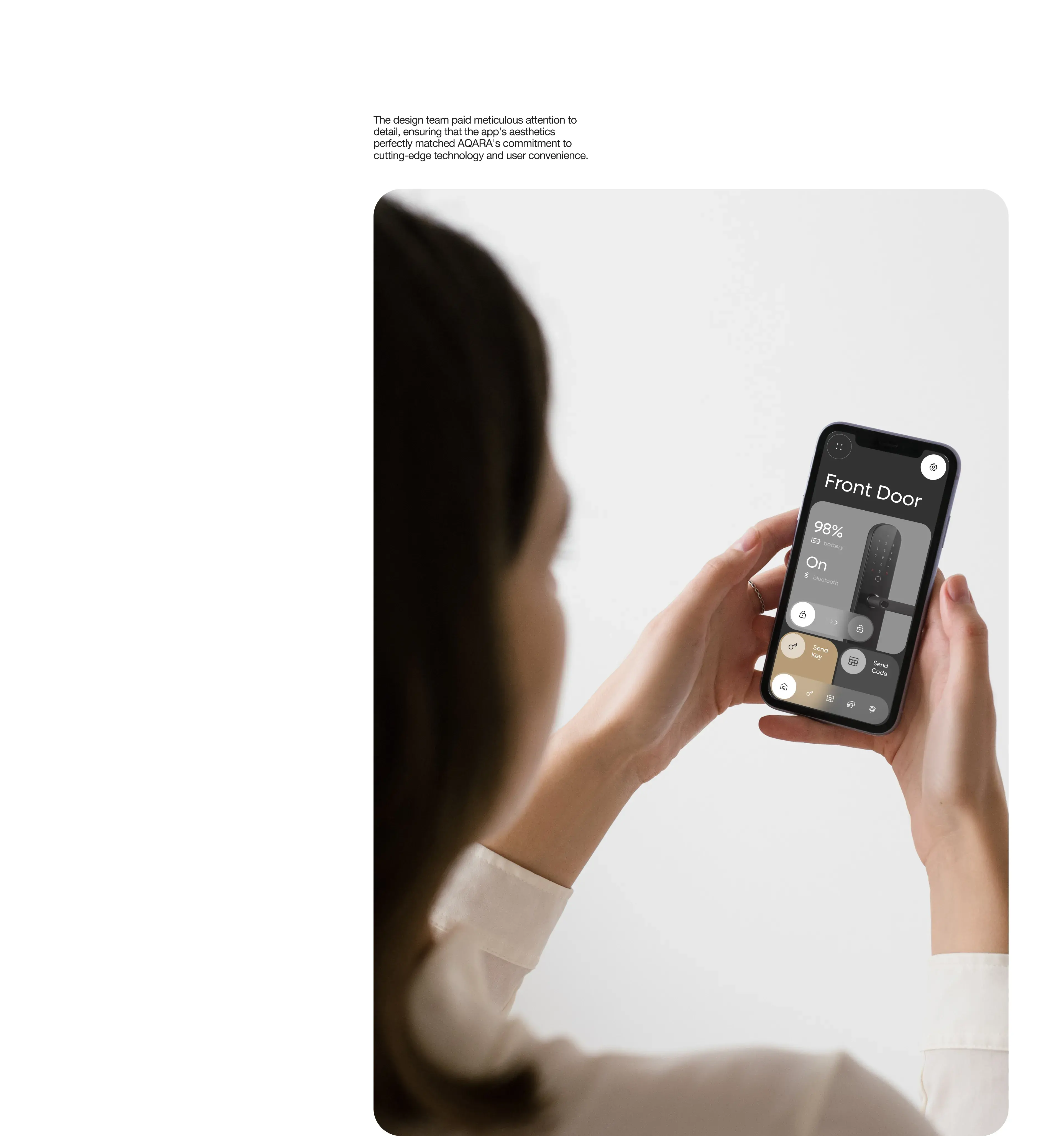Hand holding an iPhone displaying a smart home control app interface. Hand holding an iPhone displaying a smart home control app interface.