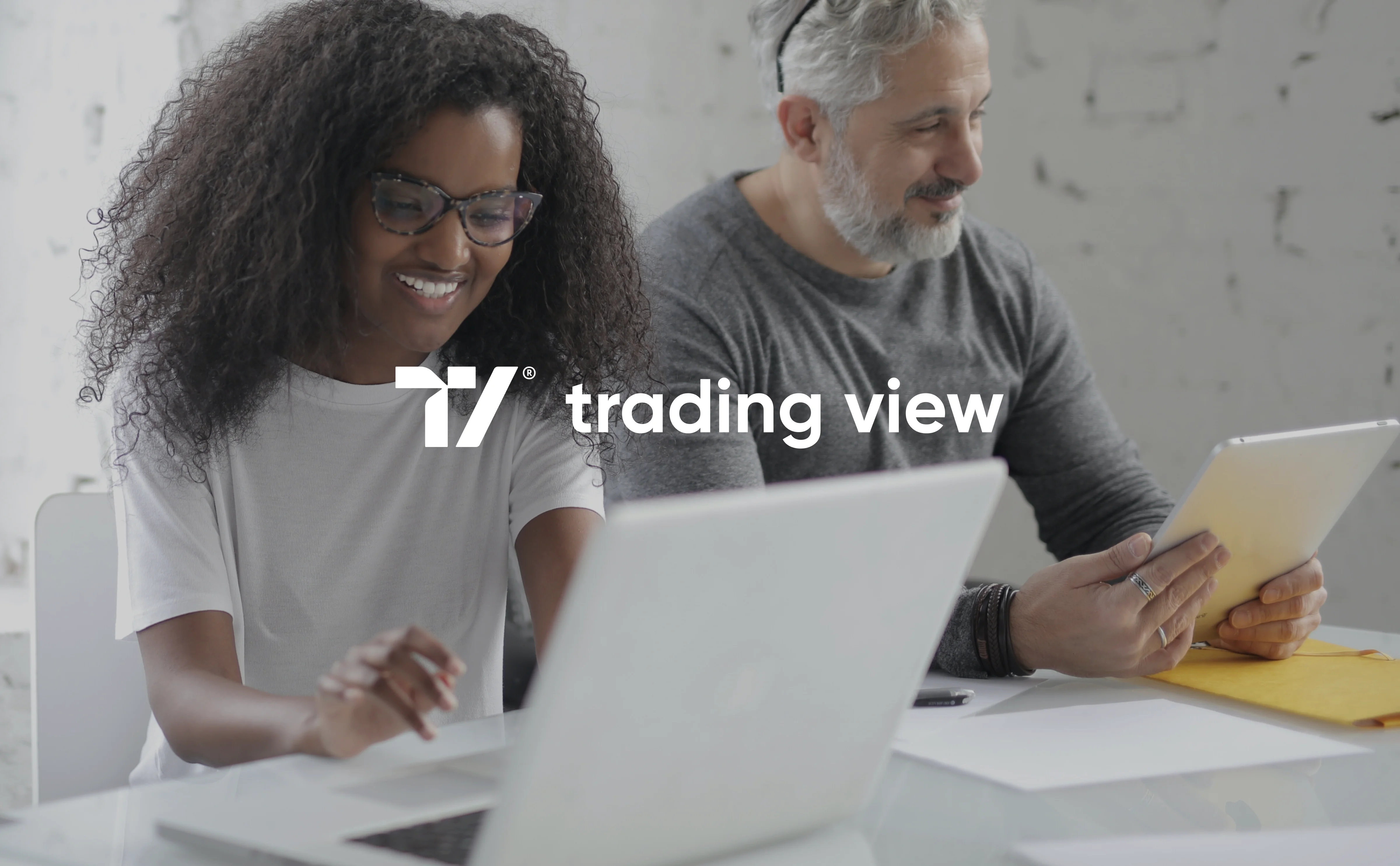 Professional using the TradingView platform on a laptop, relevant to the product design case study. Professional using the TradingView platform on a laptop, relevant to the product design case study.